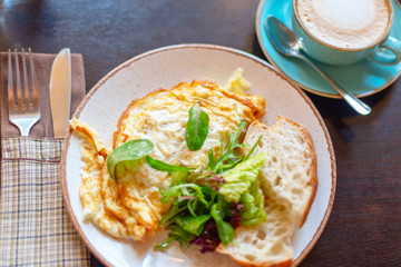omelet and cappuccino for breakfast