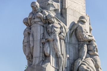 Fototapeta na wymiar Statues on the Freedom Monument in Riga city, Latvia