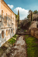 Bridges across the former moat in the park of the old city in Girona, Spain