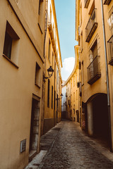 Fototapeta na wymiar Narrow street in old town. Girona, Catalonia