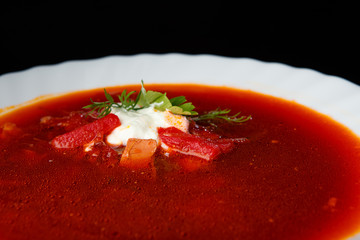 Vegetable soup with beets, rustic style, selective focus