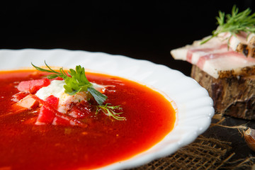 Vegetable soup with beets, rustic style, selective focus