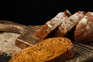 Fresh homemade bread on wooden plank,  food close up