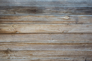 Obraz premium The texture of weathered wooden wall. Aged wooden plank fence of horizontal flat boards.