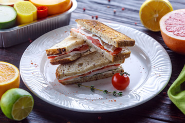 Green turkey sandwich and tomapapi on toasted whole grain bread toast