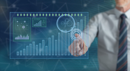 Man touching a financial analysis concept