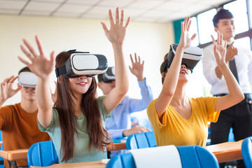 students having fun with new technology vr headset in classroom