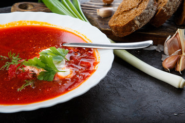 Vegetable soup with beets, rustic style, selective focus