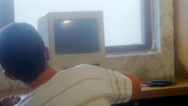 Vintage Kid exploring old computer