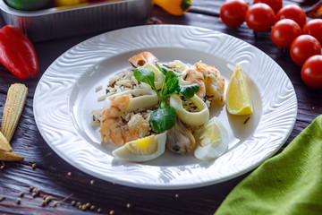 Steamed rice with shrimp, squid rings mussels and boiled eggs.