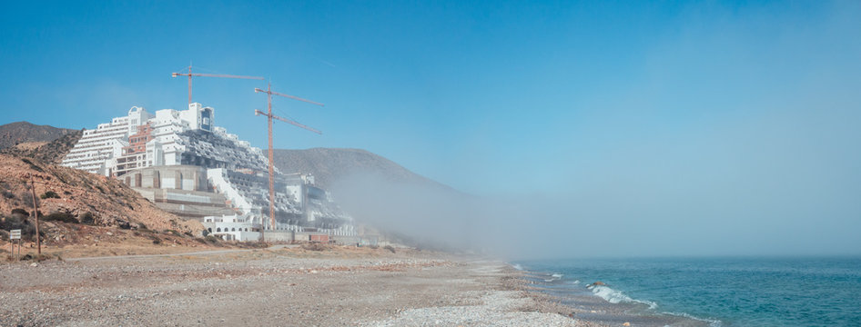 CARBONERAS, ALMER&Iacute;A, ANDALUSIA, SPAIN. March 3, 2019: Panoramic view of the hotel the Algarrobico. Illegal construction on the coast on a foggy day.