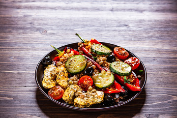 Pepper stuffed with groats and vegetables and grilled chicken strips