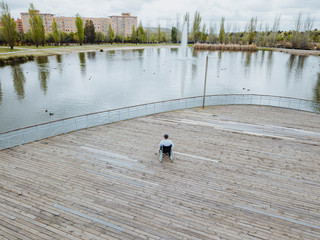 Obraz premium 43 year old male sitting on a wheelchair in the park