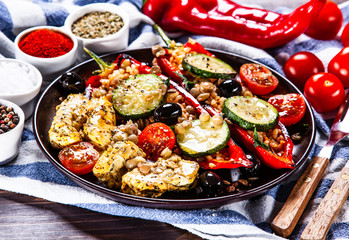 Pepper stuffed with groats and vegetables and grilled chicken strips
