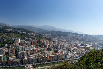 Fototapeta na wymiar Genoa Cityscape with mountains on background. Italy