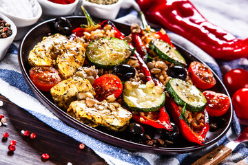 Pepper stuffed with groats and vegetables and grilled chicken strips