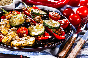 Pepper stuffed with groats and vegetables and grilled chicken strips