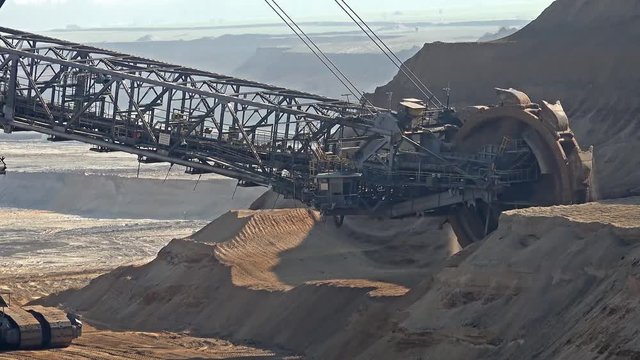 Bucket-wheel excavator in open-cast mining pit in Germany