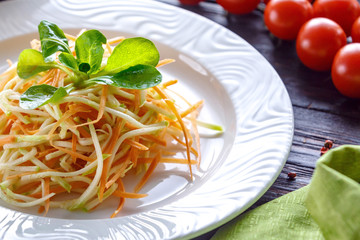 Fresh grated carrot salad with soya sprouts.