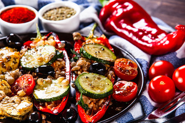 Pepper stuffed with groats and vegetables and grilled chicken strips