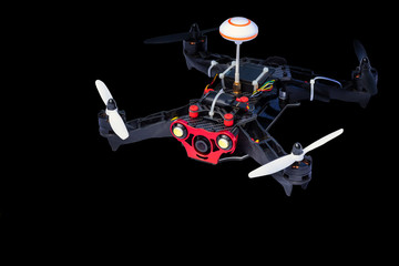 Dron, quadro copter Isolated on black background, closeup.