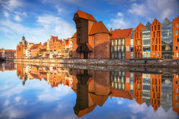 Fototapeta na wymiar Old town of Gdansk reflected in the Motlawa river at sunrise, Poland.