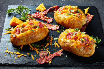close-up of Loaded Potatoes on a stone plate