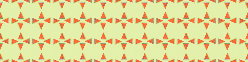 panoramic shot of pattern with handmade paper watermelon slices isolated on green