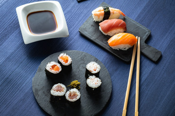 varied sushi plate on wood table