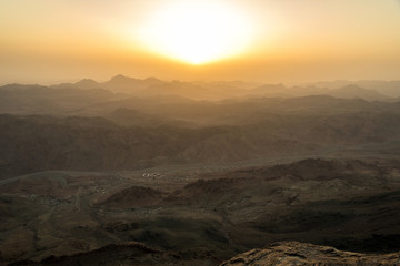 View of the sunrise on the bare mountain from the top of the mountain