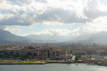 Aerial view from the sea of Palermo with mountains and clouds on background