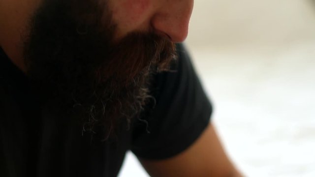 close up bottom to top shot drunk middle-aged man hypster feeling depressed and drinking a glass of whisky 4k