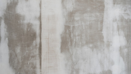 Wall in white paint during repair. Background texture.