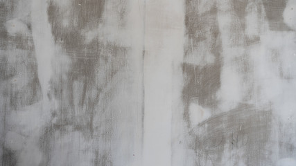 Wall in white paint during repair. Background texture.