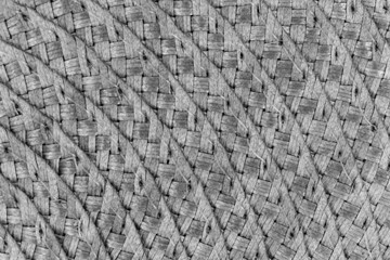 Woven black and grey wicker straw background or texture
