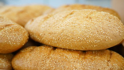 Bread. fresh loaf of bread in market .bakery background. baguette in food store