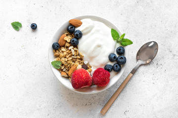 Granola with yogurt and berries - obrazy, fototapety, plakaty