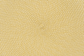 Woven yellow wicker straw background or textur