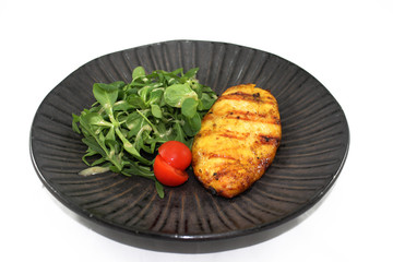 grilled beef steak with vegetables on white plate