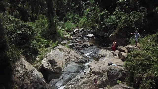 AERIAL: pushing through the trees towards a small stream that creates Mango Waterfall in Adjuntas, Puerto Rico.