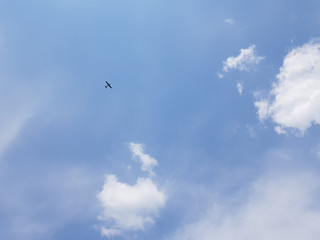 Plane away in the blue sky.