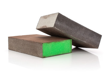 Group of two whole grey and green abrasive block sponges work item isolated on white background
