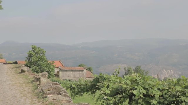 Pan in to the mountains in a rural village on a hill Friaes Tras-os-Montes Portugal