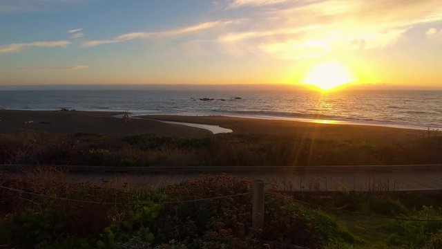 Time lapse hyperlapse of a colorful sunset over the Pacific Ocean at Moonstone Beach Park in Cambria California