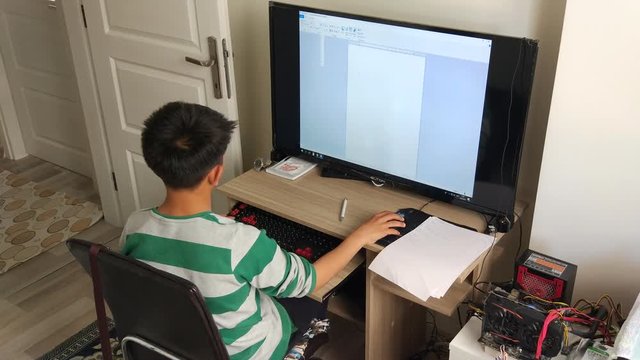 Child doing homework at home.