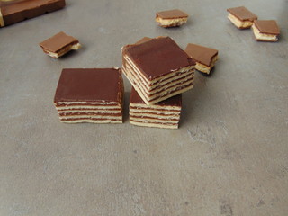 Sweet hungarian cake on wooden surface, close up view.