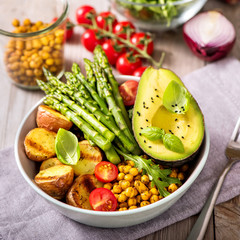 Buddha bowl with green asparagus and  baked potatoes, spicy chickpeas, avocado, arugula, vegan, vegetarian healthy food - 263881823
