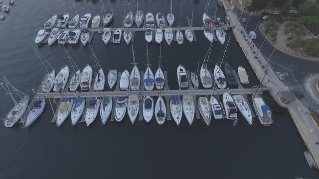 AERIAL: Tilt Shot of Sailboats in the Harbour of Bormla, Malta