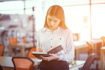 Businesswoman with notepad