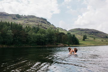 Couple kissing in the lake